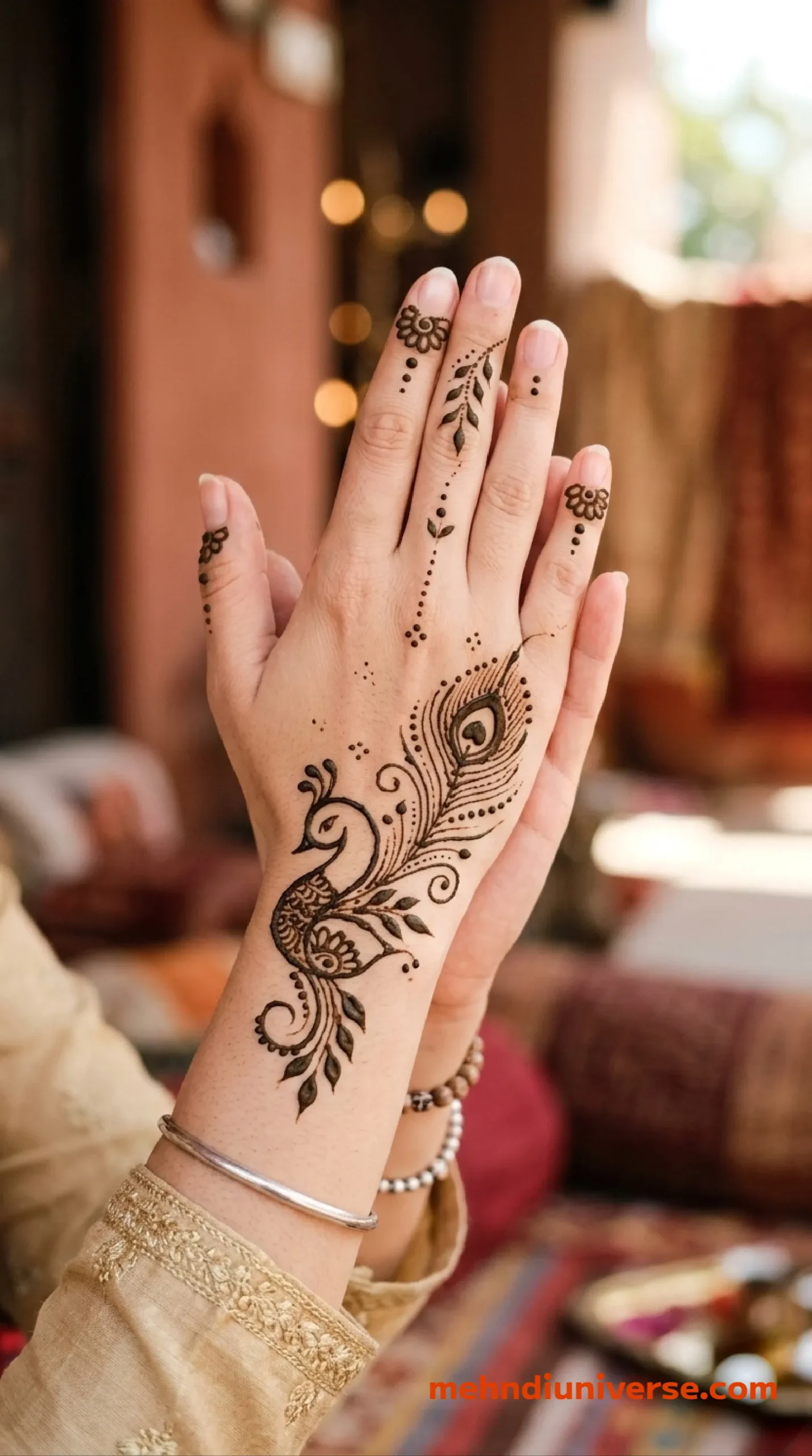 Simple royal mehndi design with peacock feather pattern on front hands 24